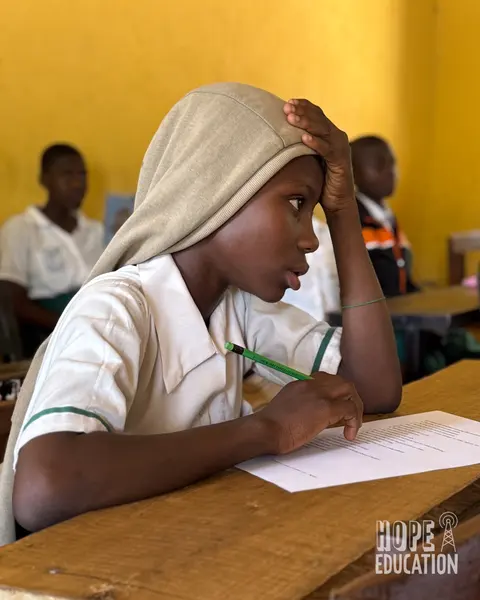 A pupil at Darrul Haddis completing M&E for Module 3 of the Hope Education Project human trafficking education program for Ghana